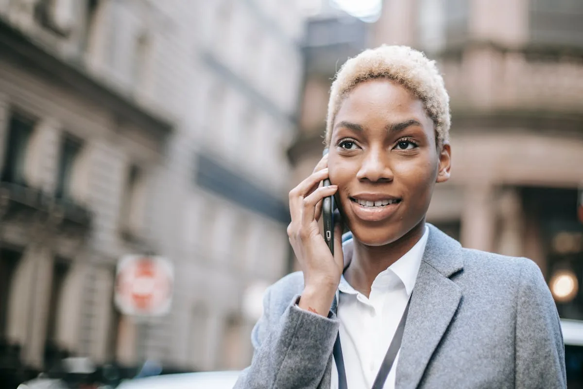 An African businesswoman making a payment on her smartphone